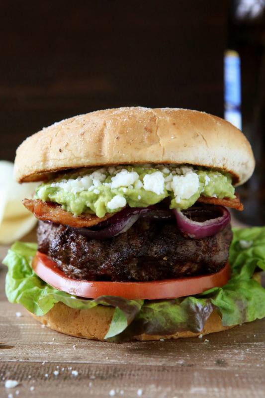 Bacon Guacamole Burgers with Grilled onions and Cotija cheese